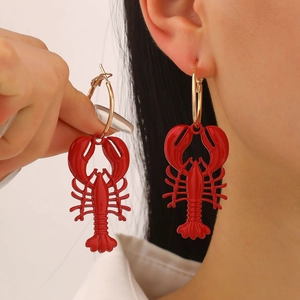 Exaggerated red lobster pendant hoop earrings with gold finish for beach vacation style