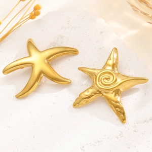 Detailed view of gold starfish brooches featuring smooth and textured metallic finishes