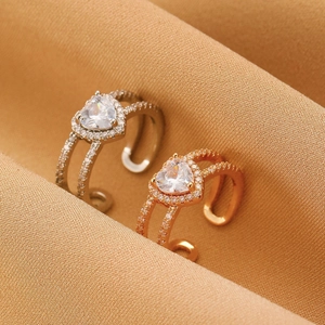 Detailed close-up of vintage heart-shaped zircon rings with adjustable open band