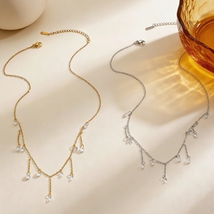Elegante kwastjeskettingen van roestvrij staal in goud en zilver met fonkelende zirkoon