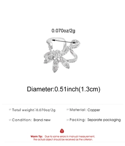 Detailed view of copper finger nail ring featuring zircon stones and size measurements