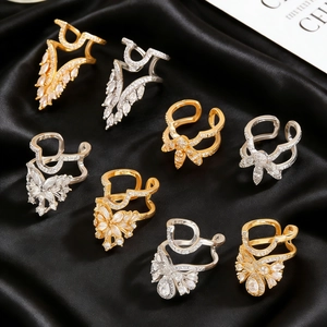 Detailed view of copper gold and silver nail rings with zircon flower and butterfly designs