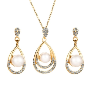 Elegant gold pearl jewelry set featuring a teardrop pendant necklace and stud earrings
