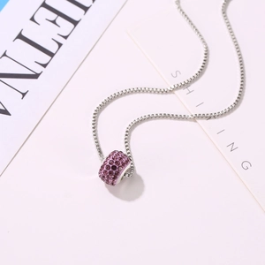 Close-up of Shamballa style purple crystal ball pendant on silver venetian box chain