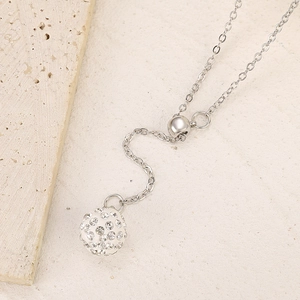 Close-up of adjustable silver necklace with sparkling crystal pave ball pendant