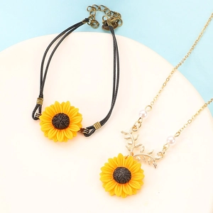 Fresh sunflower daisy jewelry set with black cord bracelet and gold pearl necklace