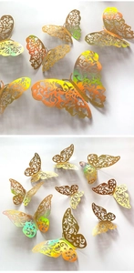 Detailed macro view of 3D gold laser-cut butterfly wall stickers with hollow vine patterns