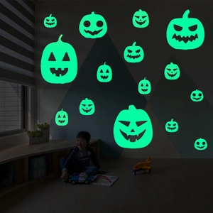 Glow in the dark Halloween pumpkin wall decals for spooky indoor party atmosphere