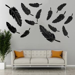 Détail macro de stickers muraux 3D en plumes acryliques noires brillantes pour salon
