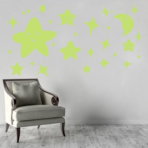 Luminous wall stickers featuring smiling stars and moon in a cozy nursery room setting