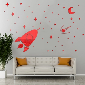 Detail view of red acrylic rocket and star mirror wall stickers in a modern living room