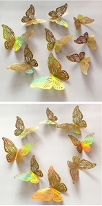 Detailed macro view of 3D gold laser cutout butterfly stickers with iridescent metallic texture