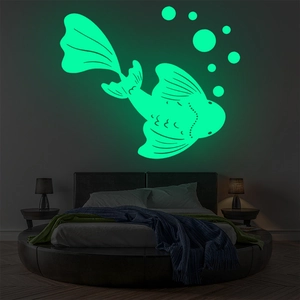 Detailed view of luminous koi fish and bubble wall stickers glowing in a dark bedroom