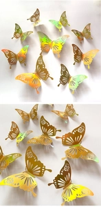Detail of 3D hollow butterfly wall stickers with gold laser finish and rose patterns