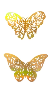 Detail of laser-cut 3D hollow gold butterflies with intricate metallic texture and patterns