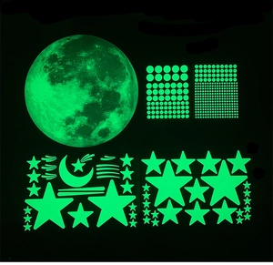 Detailed view of luminous moon and stars wall stickers set glowing in the dark