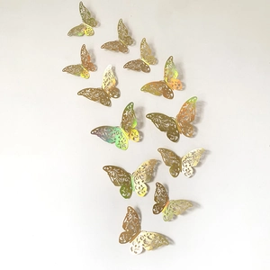 Set of 12 gold hollow 3D butterfly wall stickers with iridescent metallic finish for decor
