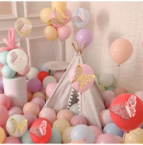 Detailed view of 3D hollow butterfly wall stickers on balloon decor in a party scene