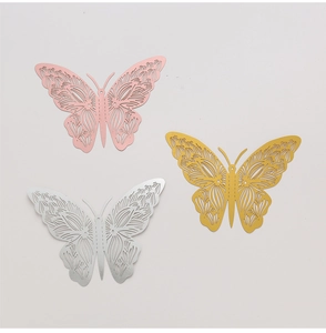 Close-up of 3D hollow butterfly wall stickers in pink, gold and silver metallic finishes