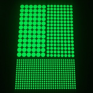 Three sizes of glow-in-the-dark dot stickers for DIY wall decoration in vibrant fluorescent green