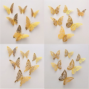 Golden 3D hollow butterfly wall stickers with four distinct decorative cutout patterns