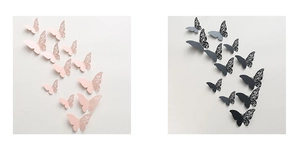 Detail of 3D cutout hollow paper butterflies in pink and black with layered effect