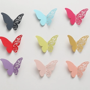 Detailed laser-cut 3D pearlescent paper butterflies with floral hollow patterns