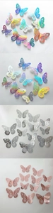 Detail of 3D hollow butterfly wall stickers in rainbow, blue, silver, and rose gold