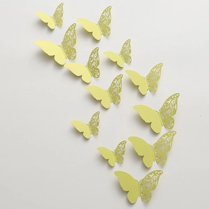 Detailed macro view of 3D light yellow laser-cut butterfly wall stickers on white backdrop