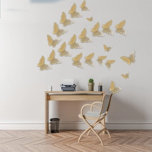 Detailed macro view of 3D gold hollow butterfly wall stickers with intricate pearlescent patterns