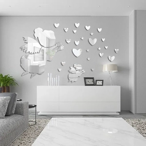 Mirror acrylic wall stickers featuring fairy and heart motifs in a modern living room
