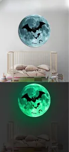 Luminous Halloween wall sticker showing bats on moon in day and night scenes