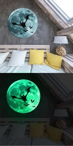 Glow in the dark moon and bats wall sticker showing day and night luminous contrast effect