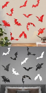 Macro view of bat-shaped acrylic mirror wall stickers in red black and white for Halloween