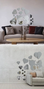 Detail of DIY cat and heart acrylic mirror wall stickers with reflective silver surface