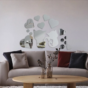 Acrylic mirror wall stickers featuring cats and hearts set in a modern living room decor