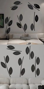 Detail of 3D black acrylic leaf wall sticker with reflective mirror effect for home decor