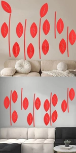 Detail of red acrylic leaf wall stickers showing glossy finish in a modern living room