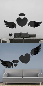 Detail of black acrylic mirror wall stickers with angel wings and heart shape design