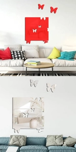 Detail view of 3D acrylic butterfly mirror wall stickers in red and silver finish