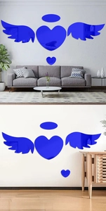 Modern blue 3D acrylic mirror heart and wings wall stickers in a minimalist living room