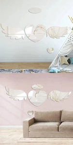 Mirror acrylic angel wings and heart wall stickers shown in bedroom and living room decor