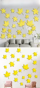 Détail macro des stickers muraux miroirs en forme de feuille d'érable en acrylique jaune