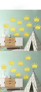 Golden crown wall stickers set for kids room decoration on a light green wall