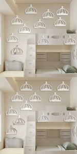 Close-up of crown-shaped acrylic mirror wall stickers in a modern children bedroom