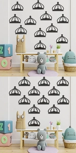 Detail of black crown acrylic mirror wall stickers in a minimalist children's room setup
