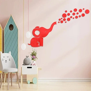 Detail of red acrylic elephant mirror wall sticker showing bubbles on pink wall surface