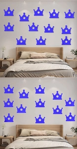 Detailed close-up of blue crown acrylic mirror wall stickers in a modern bedroom layout