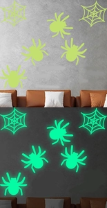 Luminous Halloween wall stickers showing contrast between daylight and green glow at night