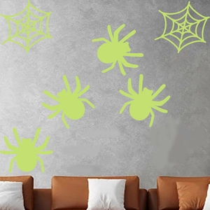 Luminous Halloween wall sticker set featuring green spiders and webs for home decoration